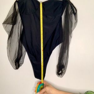COPY - Black, puffy, sheer on arms one piece bodysuit.